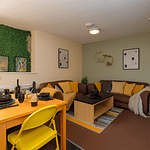cosy student house to rent lancaster. Vibrant student living room in Lancaster with smart TV and comfy sofa, ideal for student accommodation in Lancaster.