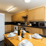 Modern student kitchen in Lancaster with dishwasher and contemporary appliances, perfect for shared student housing.. student house with washer dryer dishwasher dining table